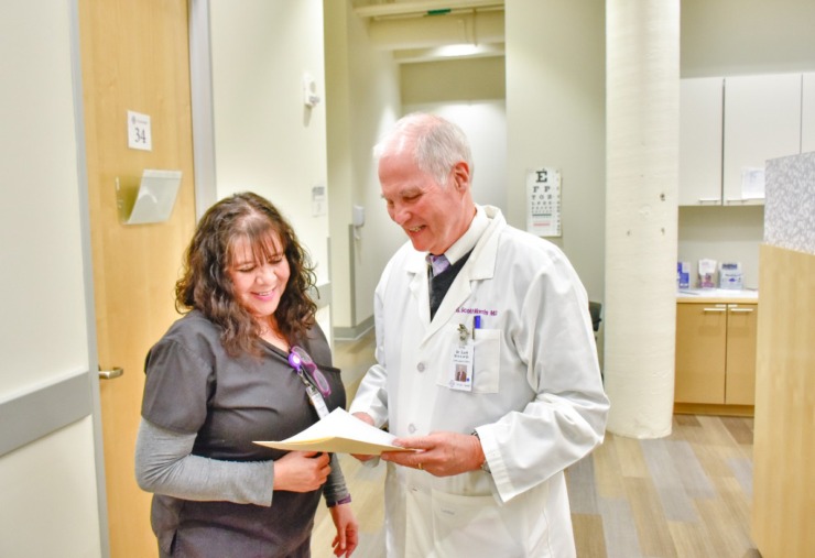Dr. Scott Morris talks with a nurse at Church Health. (Courtesy Church Health)