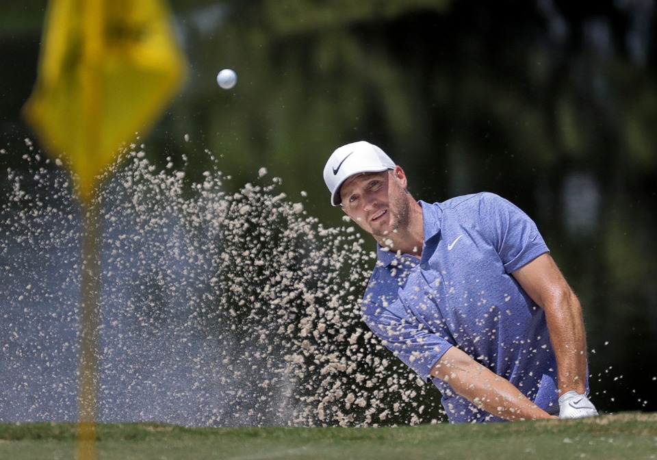 <strong>Webb Simpson blasts out of the sand onto the 4th green during the third round of tournament play at the WGC-FedEx St. Jude Invitational at TPC Southwind on July 27, 2019.</strong> (Jim Weber/Daily Memphian)
