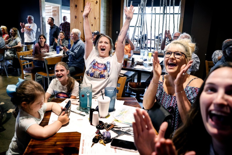 <strong>Leah Johnson (middle) cheers with family and friends while attending a watch party for her family&rsquo;s appearance on the television show &ldquo;Family Feud&rdquo; on Friday, May 10, 2024, at Kooky Canuck.</strong> (Mark Weber/The Daily Memphian)