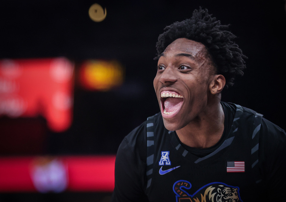 <strong>University of Memphis forward Nae'qwan Tomlin (7) reacts to a three-pointer during a Feb. 21, 2024, game against Charlotte.</strong> (Patrick Lantrip/The Daily Memphian file)