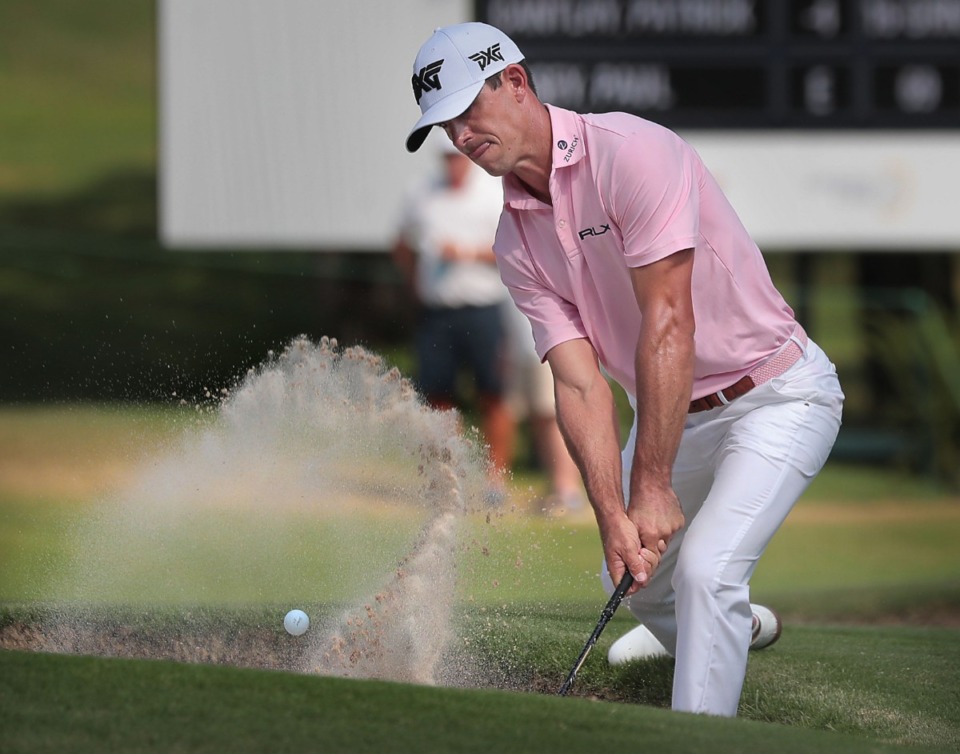 <strong>Billy Horschel chips out of the sand on the 17th green during the third round of tournament play at the WGC-FedEx St. Jude Invitational at TPC Southwind on July 27, 2019.</strong> (Jim Weber/Daily Memphian)