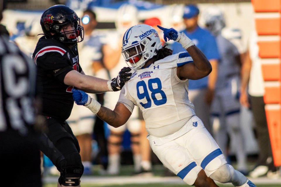 <strong>Georgia State defensive lineman Javon Denis (98) works around Ball State offensive lineman Porter Haught (74) during the second half of the Camellia Bowl on Saturday, Dec. 25, 2021, in Montgomery, Ala.</strong> (AP Photo/Vasha Hunt)