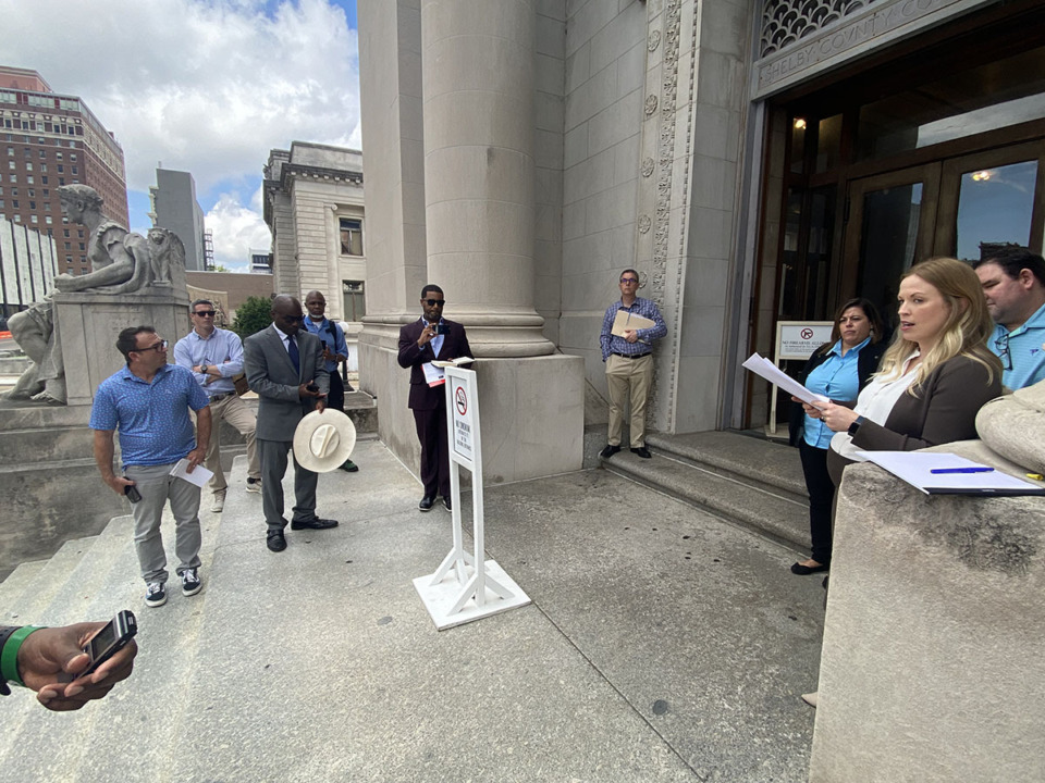 <strong>The foreclosure sale for The Lake District took place on the steps of the Shelby County Courthouse May 14. Substitute trustee Locke Waldrop, far right, from Baker Donelson conducted the sale.</strong> (Michael Waddell/Special to The Daily Memphian)