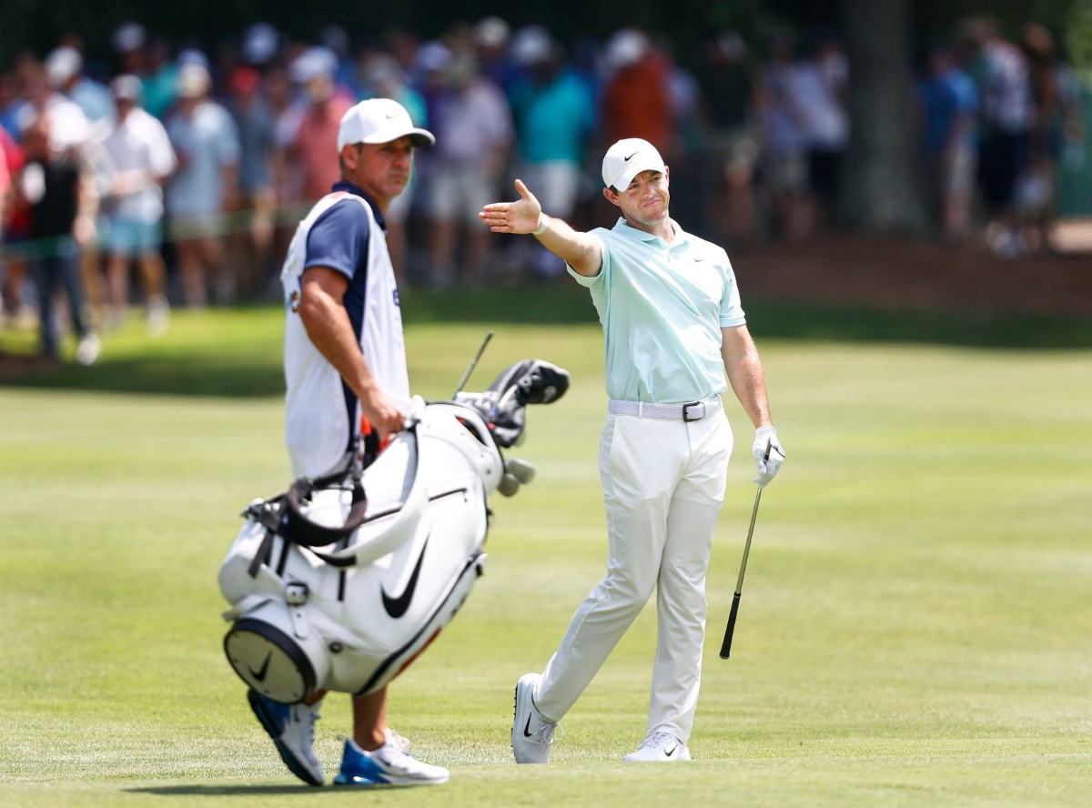 <strong>Rory McIlroy mimics the direction of his shot at the sixth hole Sunday.</strong> (Mark Weber/Daily Memphian).