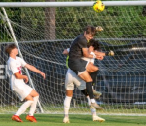 <strong>Houston High School's Trotter Jones fights to land a header for a goal against a host of Bartlett defenders Wednesday, May 15.&nbsp;</strong>(Greg Campbell/Special to The Daily Memphian)
