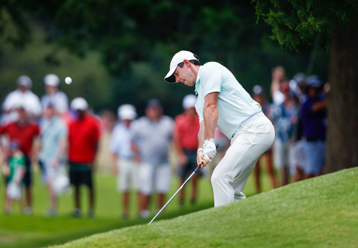 <strong>Rory McIlroy chips from the side of a hill onto the green Sunday.</strong>&nbsp;(Mark Weber/Daily Memphian).