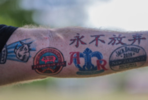 <strong>Wayne Dil shows off his Memphis in May tattoo at the BBQ War tent from New Zealand during the third day of the Memphis in May World Championship Barbecue Cooking Contest at Liberty Park May 17.</strong> (Patrick Lantrip/The Daily Memphian)