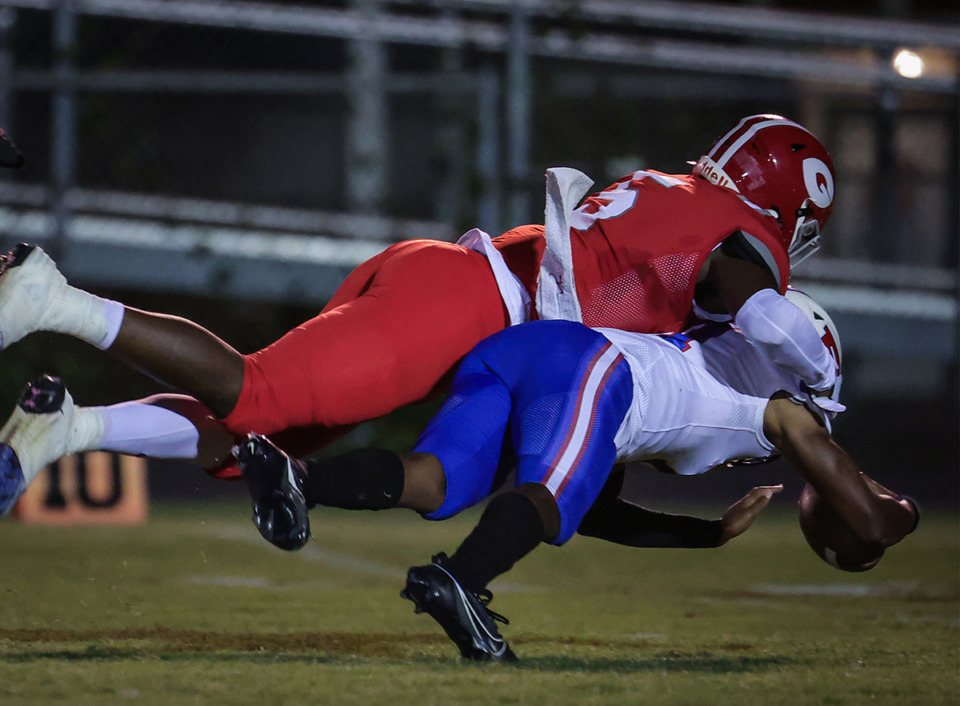 <strong>Germantown linebacker DJ Allen (5) sacks the opposing quarterback during an Oct. 6, 2023, game against Bartlett.</strong> (Patrick Lantrip/The Daily Memphian file)