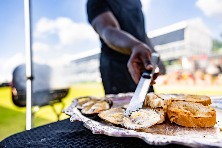<strong>Andre Mcswain takes his oysters on his grill during SmokeSlam May 17.</strong>(Benjamin Naylor/The Daily Memphian)