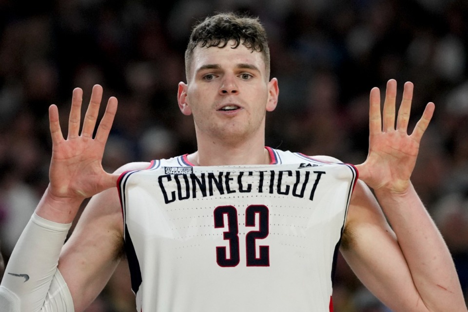 <strong>UConn center Donovan Clingan (32) celebrates after their win against Purdue in the NCAA college Final Four championship basketball game, Monday, April 8, 2024, in Glendale, Ariz.</strong> (AP Photo/David J. Phillip)