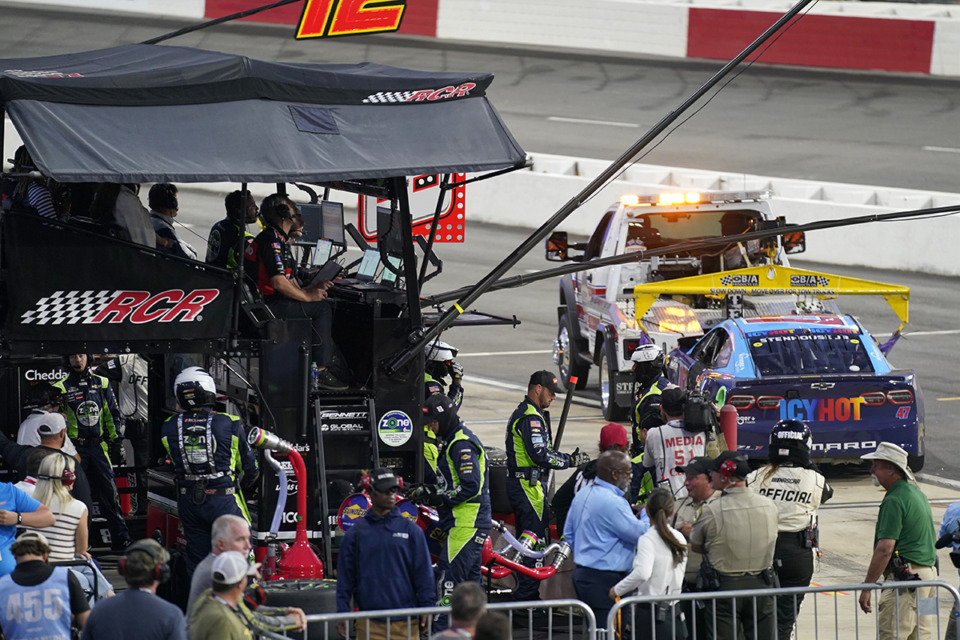 <strong>The car of Ricky Stenhouse Jr. is towed away from the pit of Kyle Busch during the NASCAR All-Star auto race at North Wilkesboro Speedway in North Wilkesboro, N.C., Sunday, May 19, 2024. Stenhouse crashed after contact with Busch and stopped his damaged car at Busch's team's pit.</strong> (Chuck Burton/AP Photo)