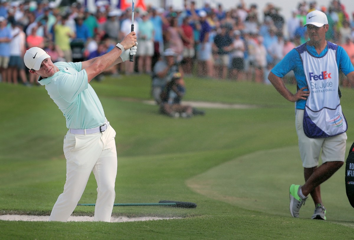 <strong>Rory McIlory punches out of a bunker on the 18th hole at the WGC-FedEx St. Jude Invitational in Memphis Sunday, July 28.</strong> (Patrick Lantrip/Daily Memphian)