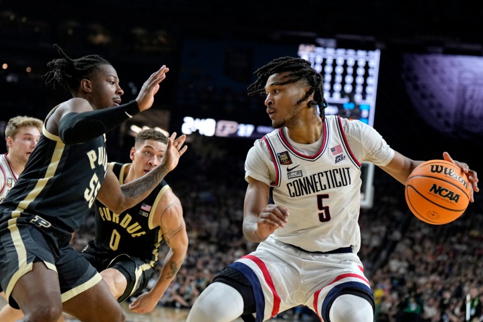 <strong>UConn guard Stephon Castle (5) drives as Purdue guard Lance Jones defends during the first half of the NCAA college Final Four championship basketball game, Monday, April 8, 2024, in Glendale, Ariz.</strong> (AP Photo/Brynn Anderson)