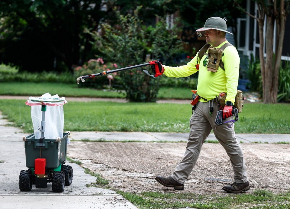 <strong>Glenn Morris collects waste with the aid of his remote controlled trash collector &ldquo;Litterbuggy&rdquo; on Wednesday, May 22, 2024 in Cooper-Young.</strong> (Mark Weber/The Daily Memphian)