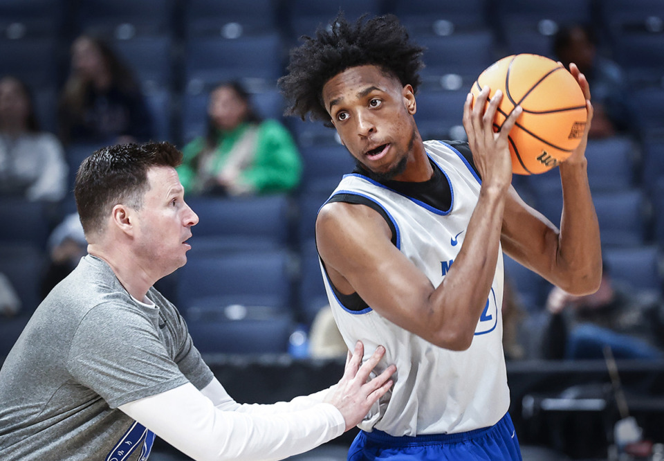 <strong>Memphis Tigers assistant coach Andy Borman (left) works with forward DeAndre Williams (right) at practice during media availability at the NCAA tournament on Thursday, March 16, 2023, in Columbus, Ohio.</strong> (Mark Weber/The Daily Memphian file)