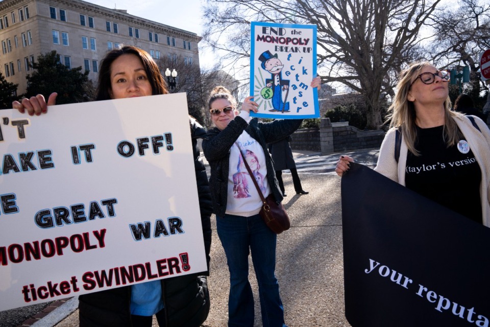 <strong>Amy Edwards, of Silver Spring, Md., left, Tracy Budrow, of Fort Belvoir, Va., and Jenn Landry, of Houston, protest Ticketmaster, Tuesday, Jan. 24, 2023, on Capitol Hill in Washington, D.C.</strong> (Jacquelyn Martin/AP File)