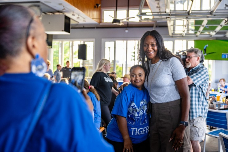 <strong>University of Memphis women's basketball head coach, Alex Simmons, hugs a fan before the second Tiger Tour at Brookhaven Pub &amp; Grill Thursday, May 30, 2024.</strong> (Benjamin Naylor/The Daily Memphian)