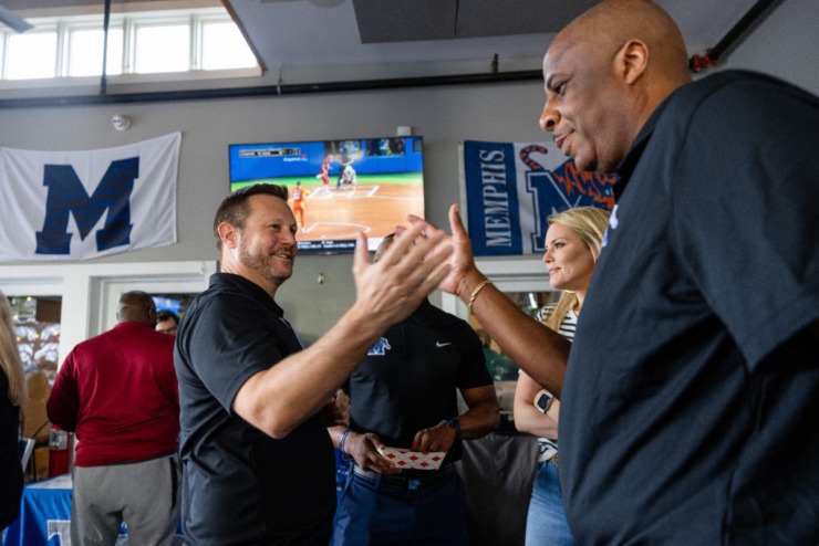 <strong>University of Memphis head football coach Ryan Silverfield talks to Ken Moody before the second Tiger Tour at Brookhaven Pub &amp; Grill Thursday, May 30, 2024.</strong> (Benjamin Naylor/The Daily Memphian)