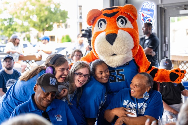 <strong>University of Memphis mascot, Pouncer, hugs fans before the second Tiger Tour at Brookhaven Pub &amp; Grill Thursday, May 30, 2024</strong>. (Benjamin Naylor/The Daily Memphian)