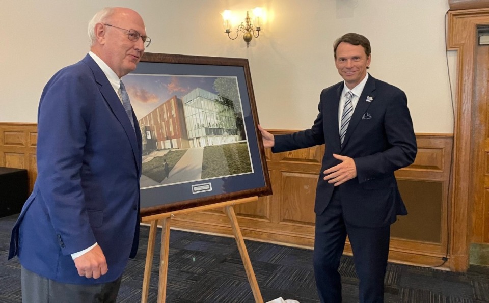 <strong>University of Memphis President Bill Hardgrave unveiled a picture of the new Edwards Research and Innovation Center with Doug Edwards (left) at the board of trustees&rsquo; meeting Wednesday, June 5, at the Lambuth campus in Jackson, Tennessee.</strong> (Jane Roberts/The Daily Memphian)