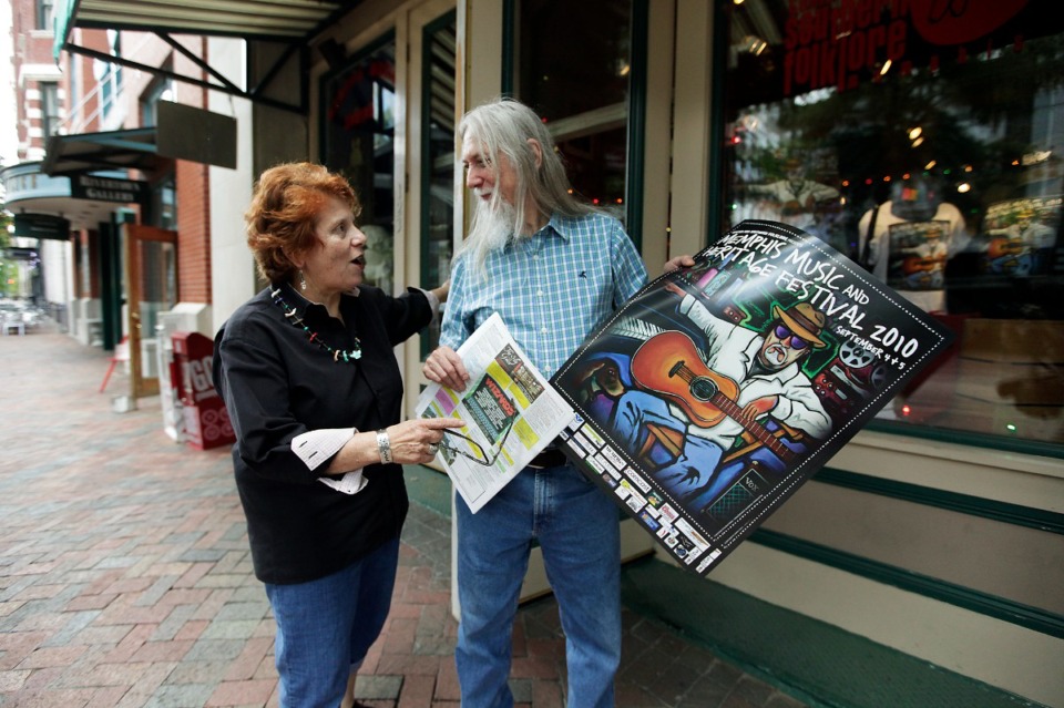 <strong>Judy Peiser (in a 2010 photo) speaks with performer Jimmy Crosthwait outside&nbsp;the Center for Southern Folklore.&nbsp;</strong>(Lance Murphey/The Daily Memphian file)