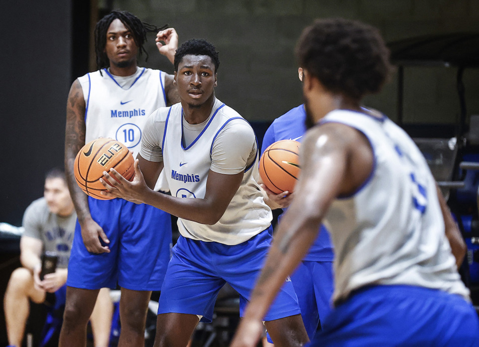 <strong>Former University of Memphis guard Carl Cherenfant (middle, at practice Sept. 27, 2023) has committed to New Mexico State.</strong> (Mark Weber/The Daily Memphian file)