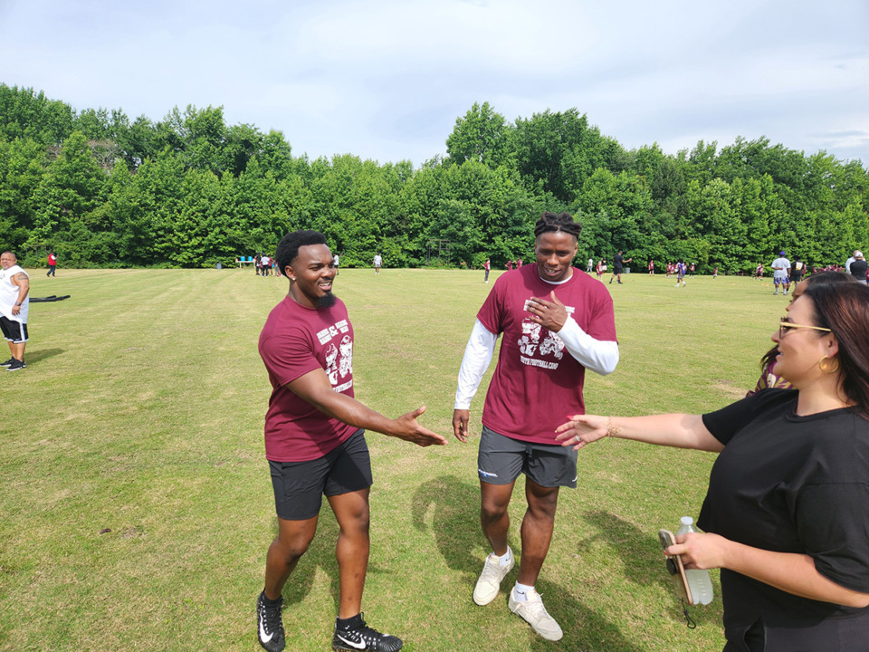 <strong>NFL linebackers Darius Harris (center right) and Nakobe Dean (center left) partnered together for a youth football camp at Horn Lake High School.</strong> (Frank Bonner/The Daily Memphian)