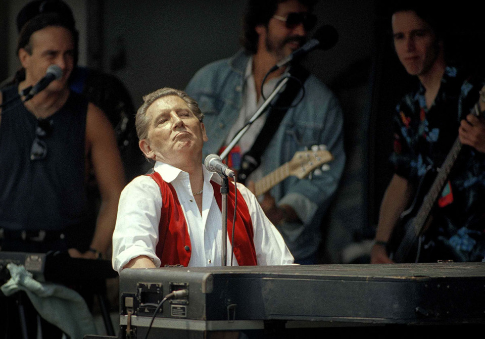 <strong>Jerry Lee Lewis performs at the topping off ceremonies for the Rock and Roll Hall of Fame in Cleveland, Ohio, July 28, 1994.</strong> (AP Photo/Tony Dejak)
