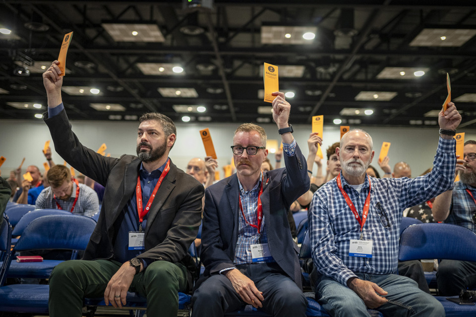 <strong>Messengers raise their ballots in support of a motion put up for vote during a Southern Baptist Convention annual meeting Tuesday, June 11, 2024, in Indianapolis.</strong> (Doug McSchooler/AP)