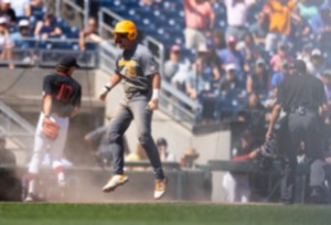 <strong>Tennessee's Blake Burke (25) celebrates after stealing home on a wild pitch in a 2023 College World Series game. Burke served up heroics again Friday night against FSU, delivering the tying single in the bottom of the ninth inning. That set the stage for Dylan Dreiling&rsquo;s game-winning single.</strong> (Rebecca S. Gratz/AP file)