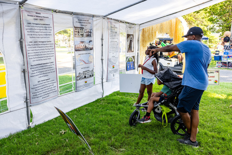 <strong>Festivalgoers view the slavery section of the Juneteenth outside museum June 15.</strong> (Benjamin Naylor/The Daily Memphian)