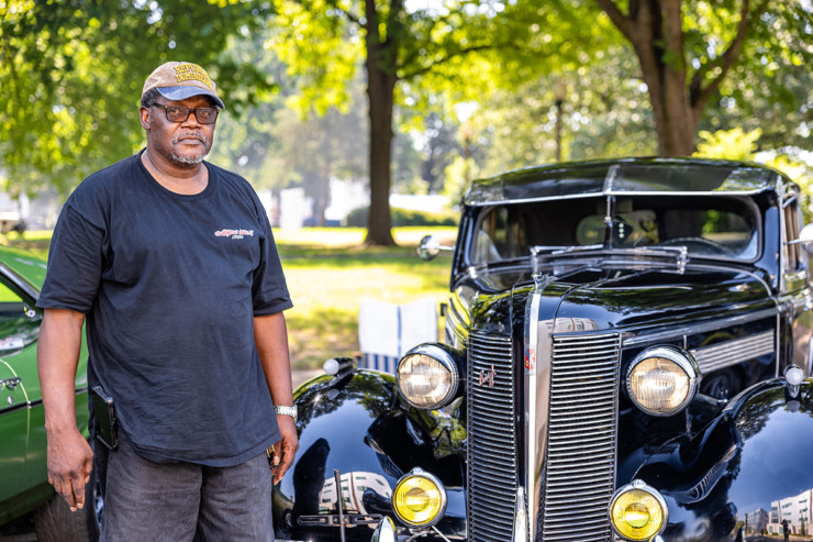 <strong>Odell Pickett stands beside his 1937 Buick special stage coach during the Juneteenth Festival June 15.</strong> (Benjamin Naylor/The Daily Memphian)