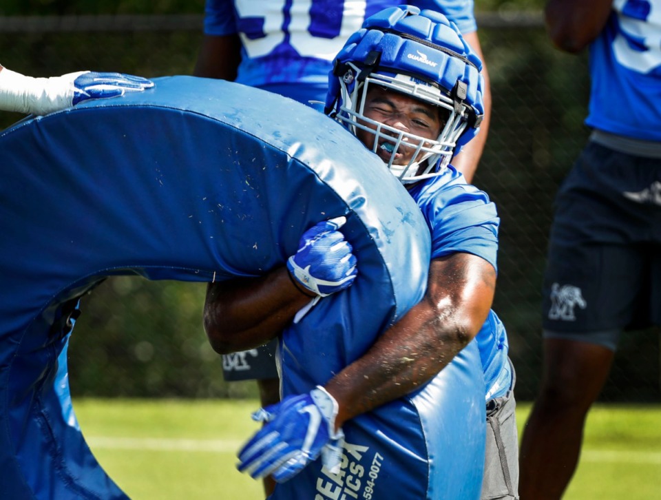 <strong>University of Memphis defensive tackle O'Bryan Goodson goes through drills during practice Friday, Aug. 2. Goodson has lost 39 pounds since he broke his foot against Wake Forest in last year's Birmingham Bowl.&nbsp;&ldquo;I wanted to elevate my game, so I felt like that was the step to do that with the new defense that we&rsquo;re in now. ...&rdquo;</strong> (Mark Weber/Daily Memphian)