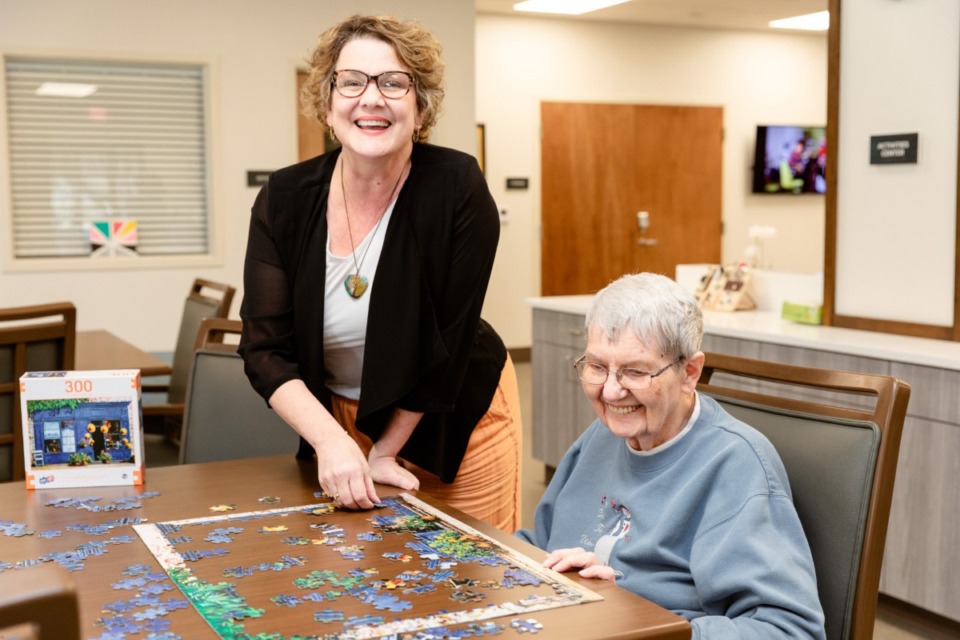 <strong>Paige Taylor, adult day center director, assists June, a participant in one of the Ronna K. Newburger center&rsquo;s program.</strong> (Courtesy Paige Miller)&nbsp;