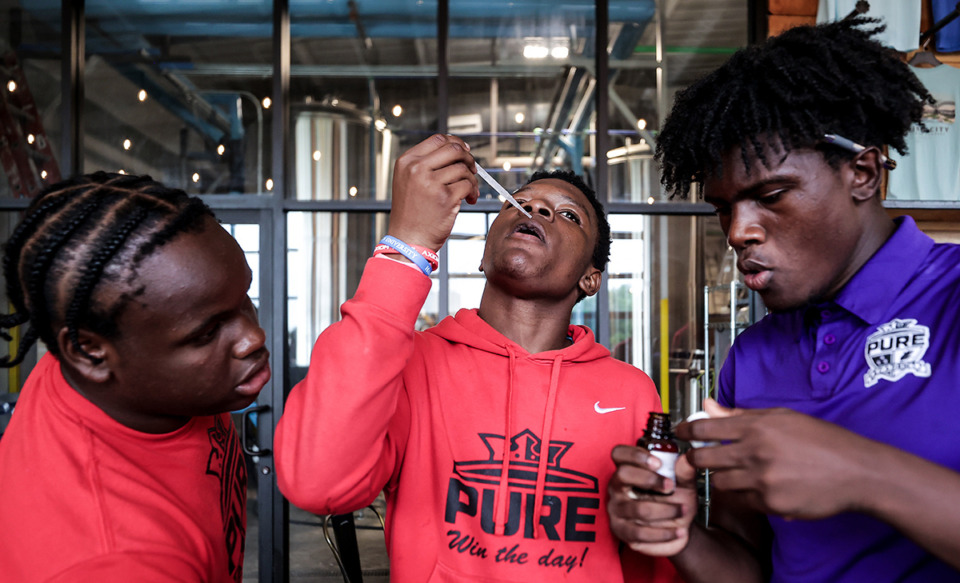 <strong>The kids from PURE Academy try to create a new soda flavor at Grind City Brewing on June 18, 2024.</strong> (Patrick Lantrip/The Daily Memphian)