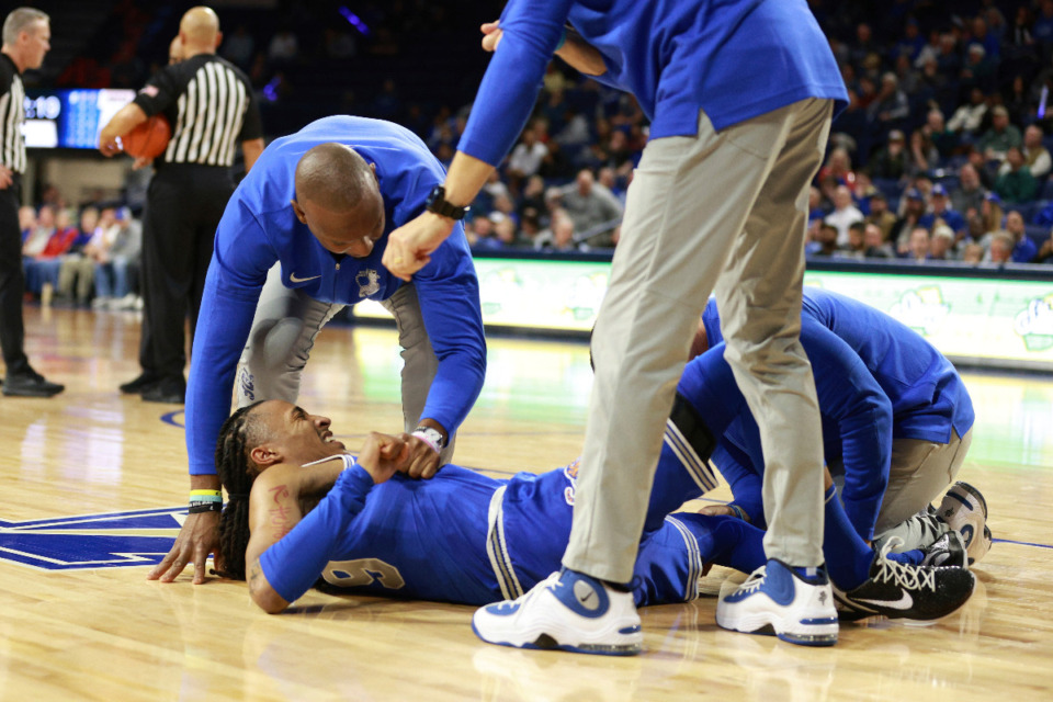 <strong>Memphis guard Caleb Mills (9) slips on the floor injuring himself while shooting during the first half of an NCAA college basketball game against Tulsa, Thursday, Jan. 4, 2024, in Tulsa, Okla.</strong> (Joey Johnson/AP Photo)