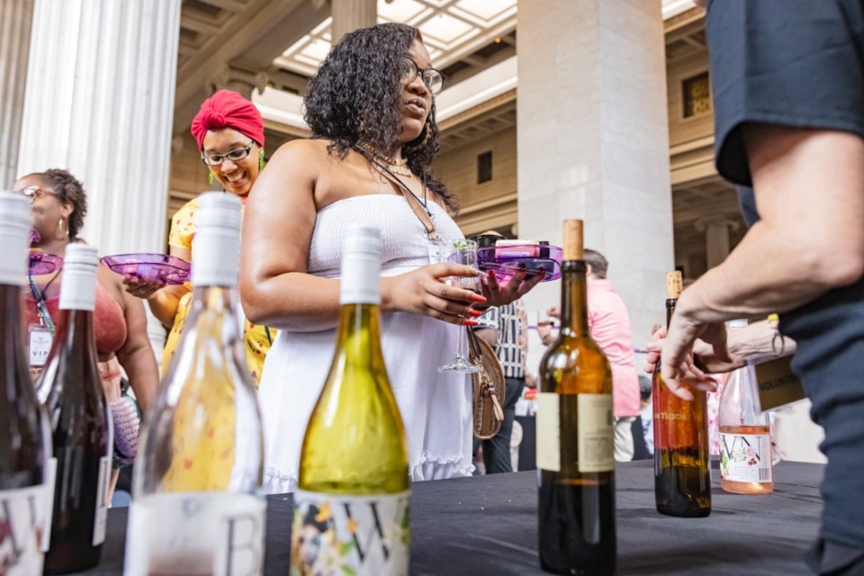 <strong>Rachial Allen samples wines at the Craft Food &amp; Wine Festival Downtown at the Columns on Sunday, June 23, 2024.</strong> (Ziggy Mack/Special to The Daily Memphian)