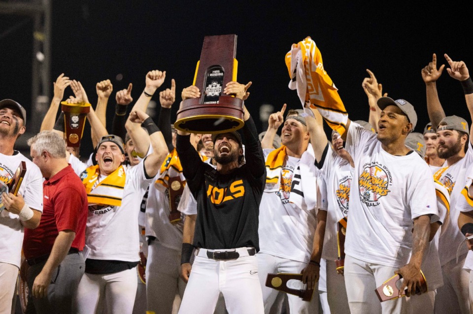 <strong>Tennessee coach Tony Vitello, middle, hoists the championship trophy following his team's 6-5 victory against Texas A&amp;M in Game 3 of the NCAA College World Series baseball finals in Omaha, Nebraska, Monday, June 24, 2024.</strong> (AP Photo/Rebecca S. Gratz)