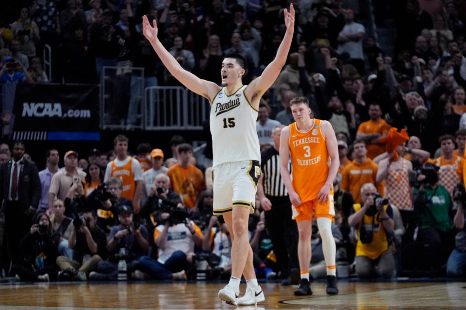 <strong>Purdue center Zach Edey (15) reacts near Tennessee guard Dalton Knecht (3) after the team defeated Tennessee in an Elite Eight college basketball game in the NCAA Tournament, Sunday, March 31, 2024, in Detroit.</strong> (AP Photo/Paul Sancya)