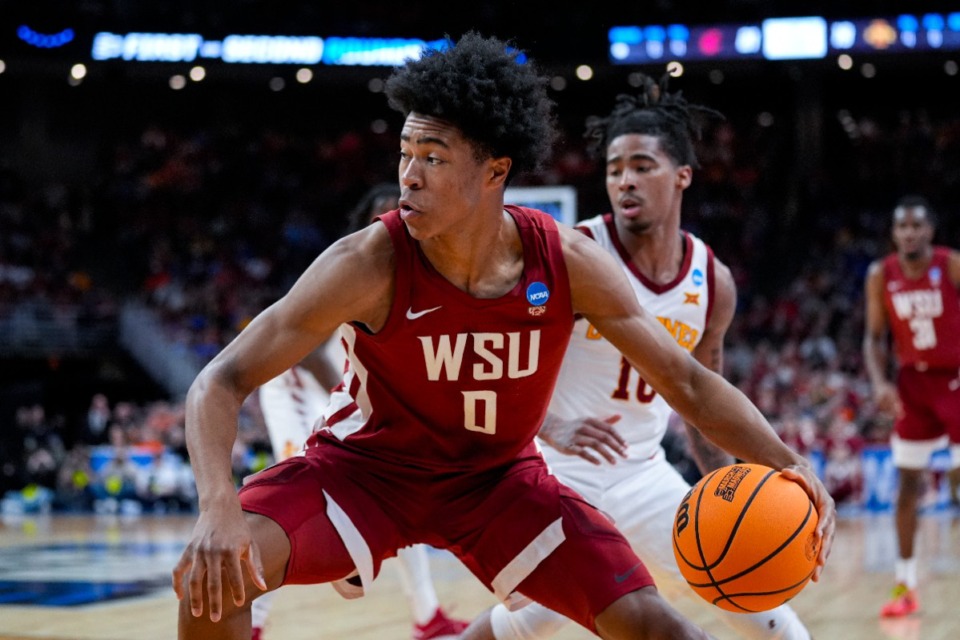 <strong>Washington State forward Jaylen Wells (0) drives on front of Iowa State guard Keshon Gilbert (10) in the first half of a second-round college basketball game in the NCAA Tournament, Saturday, March 23, 2024, in Omaha, Neb.</strong> (Charlie Neibergall/AP Photo file)