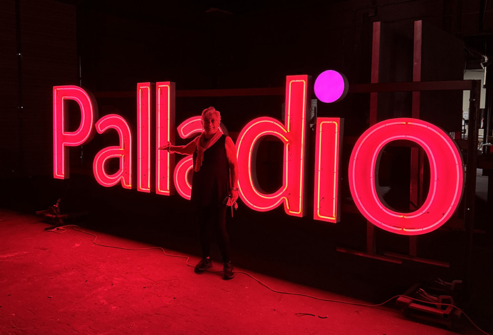<strong>Cynthia Ham stands in front of the new Palladio Interiors and Garden neon sign designed by Memphis artist Kong Wee Pang.&nbsp;The dot over the letter &ldquo;i&rdquo; changes colors.&nbsp;</strong> (Courtesy Cynthia Ham)