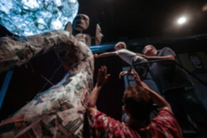 <strong>David Rosenberg helps his son, Ian, 5, attach a piece of clay to Mike McCarthy's David Bowie statue at Off the Walls Arts Sunday, June 30. The sculpture is 10 feet tall.</strong> (Patrick Lantrip/The Daily Memphian)