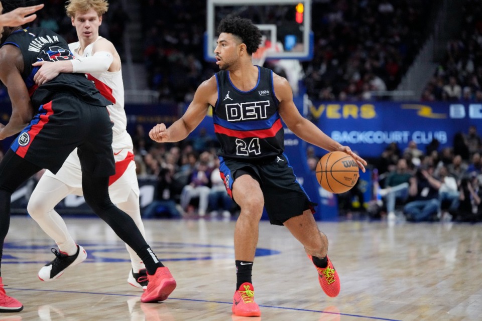 <strong>Detroit Pistons guard Quentin Grimes controls the ball during the second half of an NBA basketball game against the Toronto Raptors March 13 in Detroit.</strong> (Carlos Osorio/AP file)