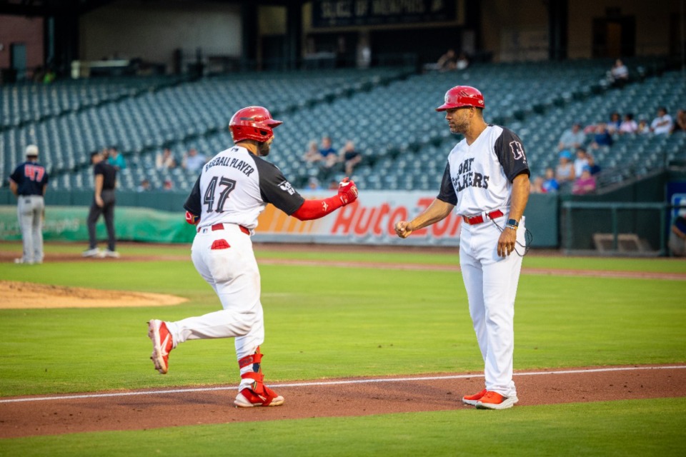 <strong>Memphis Redbirds manager, Ben Johnson, fist bumps a player after a home run during the July 2 game against the Nashville Sounds.</strong> (Benjamin Naylor/The Daily Memphian)