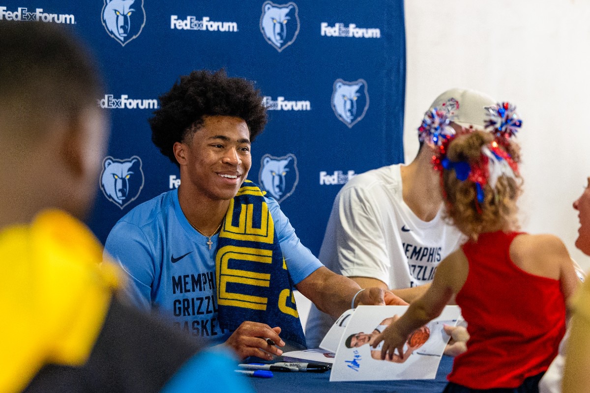 <strong>Jaylen Wells smiles as a young fan asks for an autograph at the Redbirds game at AutoZone Park Wednesday, July 3, 2024.</strong> (Benjamin Naylor/The Daily Memphian)