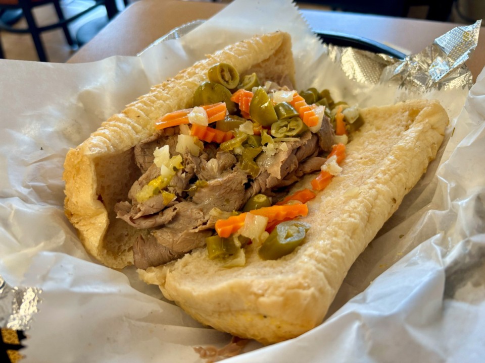 <strong>The Italian beef sandwich at Mr. Rusty's is adorned with hot and spicy giardiniera, the pickled vegetables.</strong> (Joshua Carlucci/Special to The Daily Memphian)