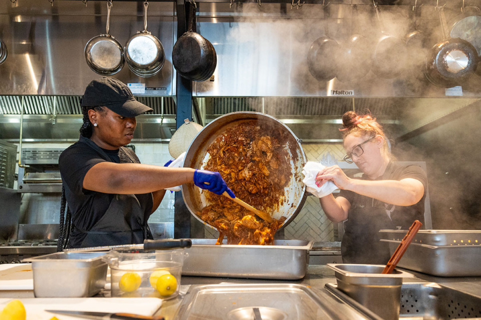 <strong>Kitchen staff prepare food for the family meal for the staff at Amelia Gene's June 27.</strong> (Benjamin Naylor/The Daily Memphian)