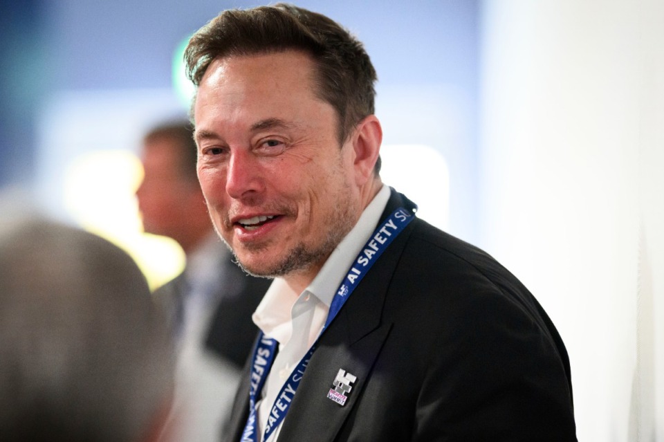 <strong>Elon Musk speaks with other delegates during the first plenary session on of the AI Safety Summit at Bletchley Park, on Wednesday, Nov. 1, 2023 in Bletchley, England.</strong>&nbsp; (Leon Neal/Pool Photo via AP)
