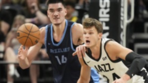 <strong>Memphis Grizzlies Zach Edey, left, and Utah Jazz Walker Kessle, right,r battle for the ball during the first half of an NBA Salt Lake City Summer League basketball game Monday, July 8, 2024, in Salt Lake City.</strong> (Rick Bowmer/AP Photo)