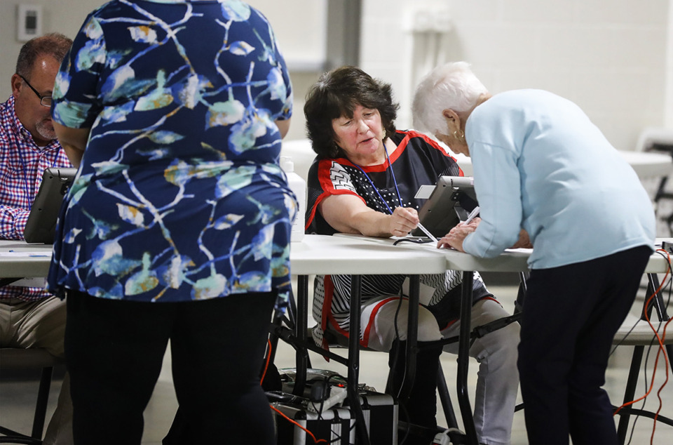 <strong>A poll worker sings in a voters on Election Day, Thursday, Aug. 4, 2022 in Arlington.&nbsp;</strong>(Mark Weber/The Daily Memphian file)